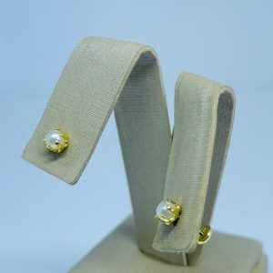 BRINCO PEROLA BP SEIS GARRAS BANHO DOURADO