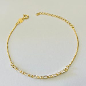 PULSEIRA CENTRO DE ZIRCONIAS BANHO DOURADO